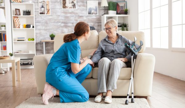 female nurse talking with an old woman
