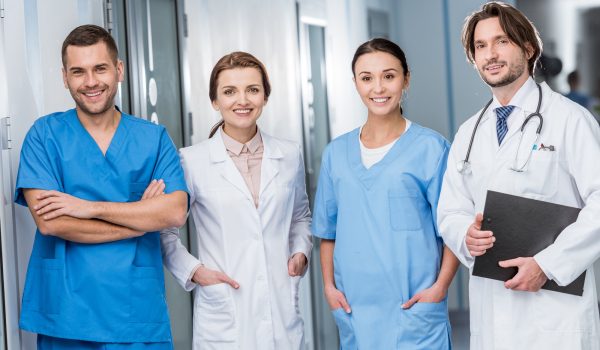 laughing doctors and nurses looking at camera