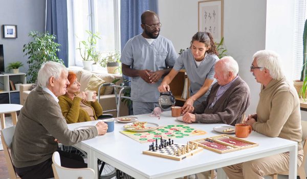 nurse caring about senior people in nursing home 7WKUE3J